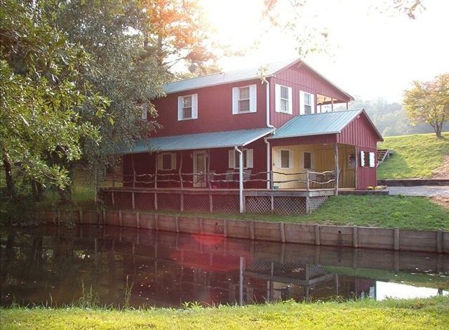 Red cottage by pond at event center